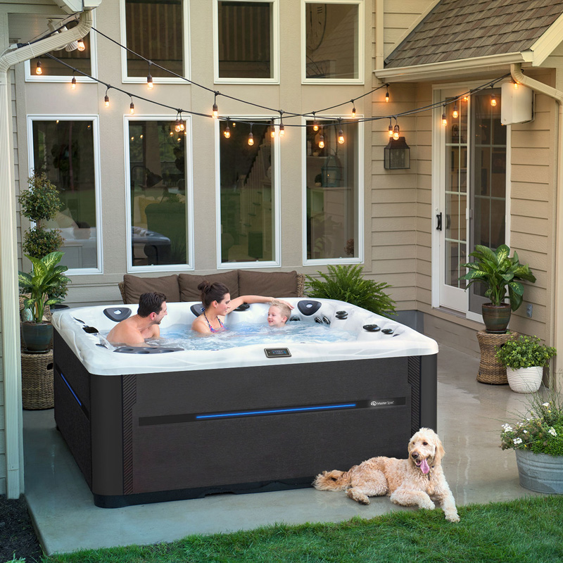 people in a hot tub outside a house